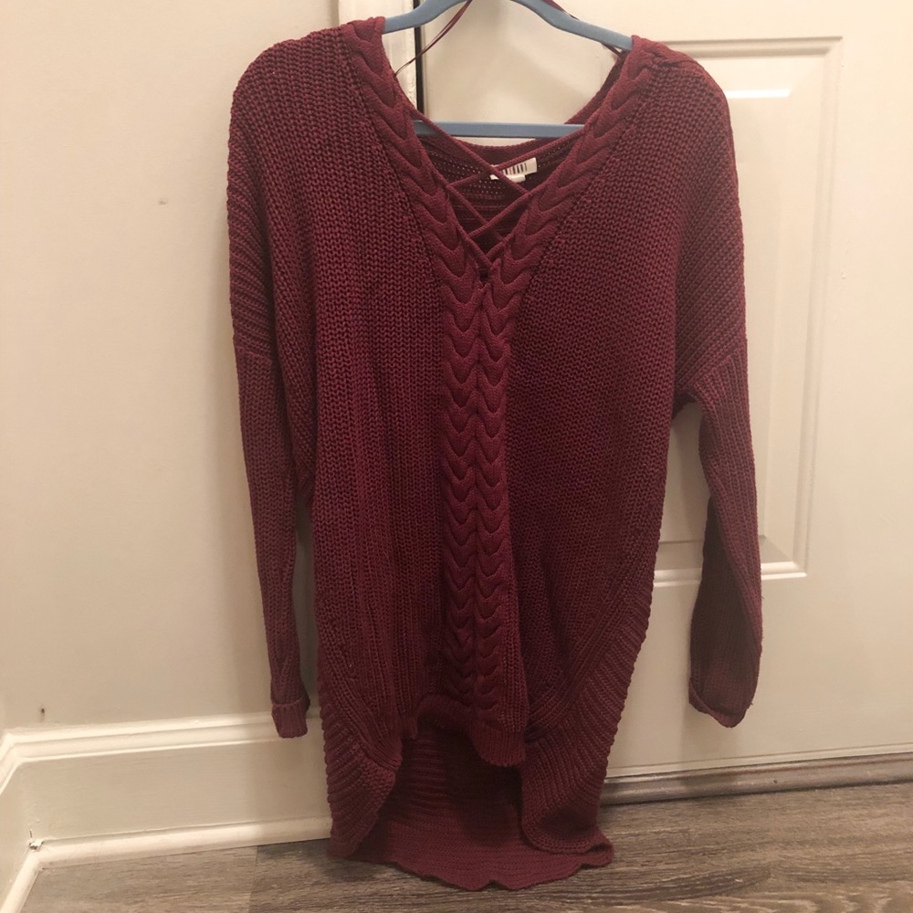 Small burgundy lace up sweater, longer in the back